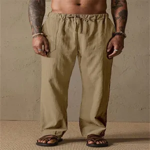 Men's casual khaki linen trousers detail view, featuring comfortable drawstring waist.