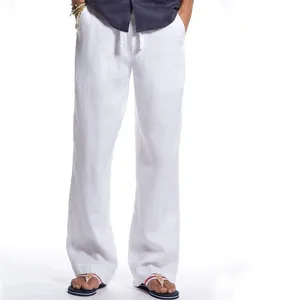 Details of men white casual linen trousers with relaxed fit and comfortable drawstring waist.