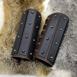 Medieval leather bracers with metal rivets, retro knight arm guards for cosplay costume detail.