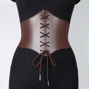 Details of the medieval vintage wide waist cincher belt showing lacing and brown texture.