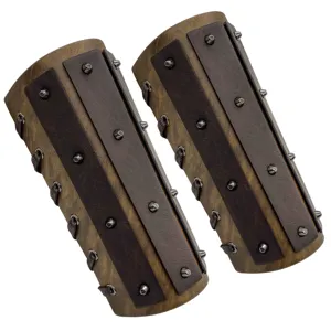 Medieval leather bracers with metal rivets, vintage knight vambrace details for cosplay.