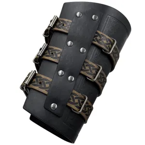 Close-up view of medieval leather bracer featuring Celtic knot straps and metal buckles.
