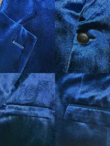 Close-up details of royal blue men velvet blazer suit jacket, showing soft velvet texture and button.