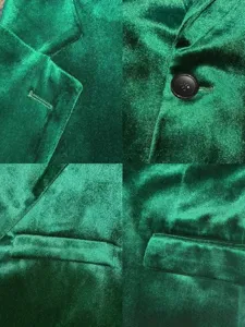 Men's velvet suit jacket detail view showing fine fabric texture, lapel and button craftsmanship.