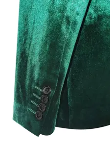 Green velvet suit jacket sleeve detail, elegant fabric texture for men formal wedding blazer.