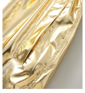 Gold metallic jacket detail, shiny performance party stage wear clothing fashion.