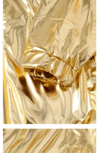 Close-up detail of shiny metallic gold jacket sleeve cuff with glossy fabric finish.