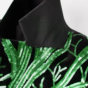 Boys sequin suit jacket detail showing green branch embroidery on black fabric for stylish kids.
