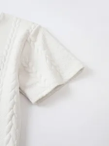 White waffle knit short sleeve detail, casual men's tee fabric close-up view.