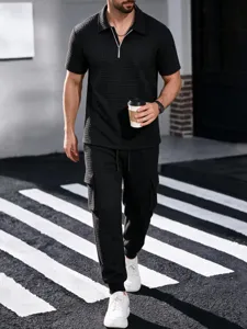 Men black waffle knit short sleeve zip polo shirt and cargo pants casual outfit detail view