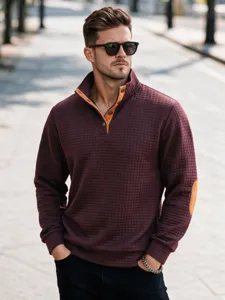 Sudadera acolchada de hombre con cuello alzado manga larga y coderas en contraste de color.