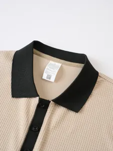 Close-up detail of men's waffle knit polo collar, contrast color design, premium fabric texture.