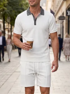 Detail view of mens white waffle knit polo shirt and shorts set with contrast collar and buttons.