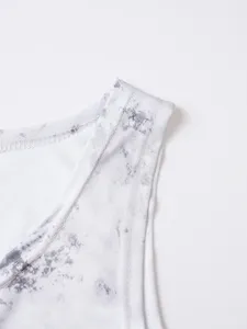 Close-up detail of men's athletic tank top strap, breathable grey tie-dye activewear.