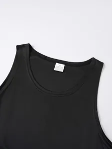 Close-up detail of black athletic tank top collar, breathable mesh fabric, minimalist design.