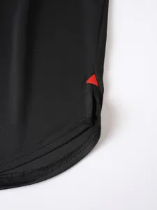 Detail shot of the hem of men's solid color breathable sports fitness running tank top.