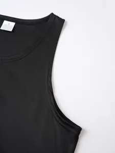 Closeup detail view of black athletic tank top collar, breathable mesh fabric, lightweight design.