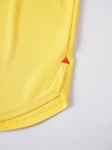 Close-up detail of breathable athletic apparel hem with mesh texture and contrast accent.