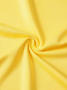 Yellow breathable mesh fabric detail for athletic sports vest, comfortable training apparel material.