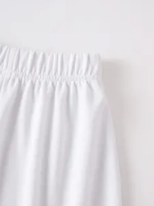 Detailed view of men casual white shorts elastic waistband, comfortable fit fabric design.