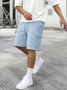 Detailed shot of light blue textured cargo shorts with cable knit pattern and side pockets.