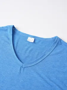Men's blue V-neck short sleeve T-shirt collar detail showing fabric texture and size label.