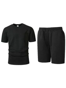 Men's black waffle knit short sleeve t-shirt and shorts casual sportswear two piece set.