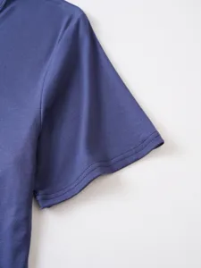 Close-up detail view of mens solid color short sleeve t-shirt sleeve, comfortable fabric.