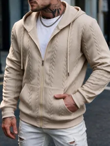 Detailed close-up of men's cable knit zip up hoodie, texture and metal zipper details.