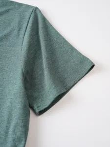 Close-up view of the short sleeve and shoulder detail on a solid color mens t-shirt soft.