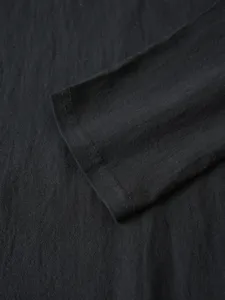 Men solid color long sleeve casual top cuff and premium fabric detail closeup view.