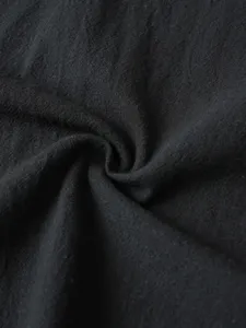 Black fabric detail and texture showcase for men casual shirt, premium close-up view.