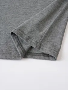 Grey mens casual tshirt detail shot showing neat stitching and soft fabric texture quality.