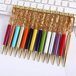 Detailed view of various colorful crystal metal ballpoint pens with gold foil filling