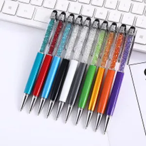 Close-up of colorful rhinestone metal pens with touch screen stylus tips
