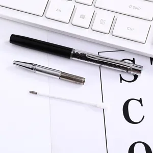 Detailed view of disassembled crystal metal ballpoint pen with refill parts