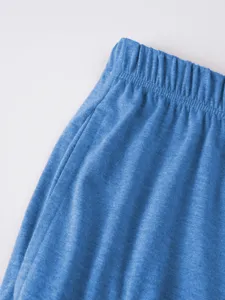 Men casual shorts waistband detail blue texture fabric close up view stylish apparel