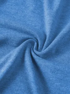 Blue fabric texture detail close-up shot showing soft knit material and smooth surface.