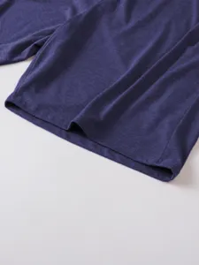 Close-up detail of men's casual apparel fabric and fine stitching craftsmanship.