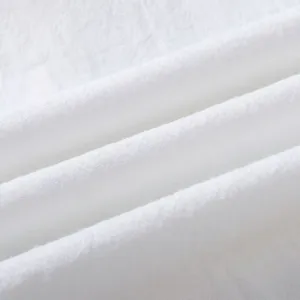 Close-up detail of white linen cotton fabric texture, soft and breathable material display.
