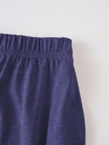 Close-up detail view of men's casual solid color elastic waistband fabric texture.