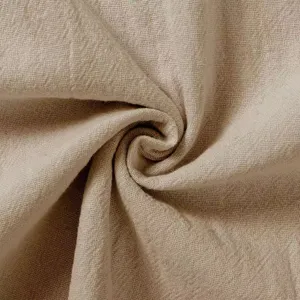 Close-up detail of breathable beige cotton linen fabric texture, soft and comfortable material.