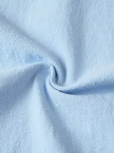 Light blue fabric detail texture close up of men casual shirt soft breathable material