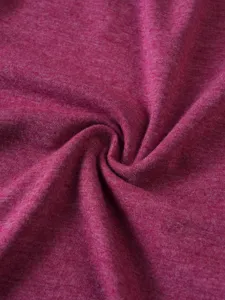 Close-up fabric texture detail showing soft magenta heather knit material surface quality.