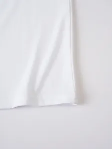 White men's casual t-shirt hem detail, soft knit fabric texture and neat stitching.