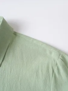 Men's solid color lapel long sleeve shirt detail view, casual beach vacation style.