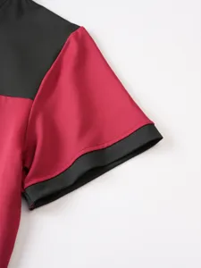 Dettaglio primo piano della t-shirt uomo a maniche corte colorblock, top patchwork casual.