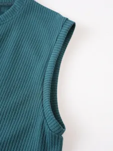 Close-up detail of mens ribbed knit vest showing fabric texture and neat stitching.