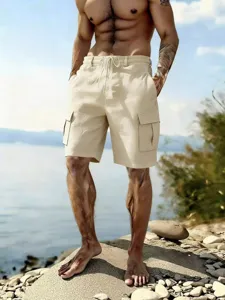 Detailed view of men's casual cargo shorts in khaki with elastic drawstring waist.