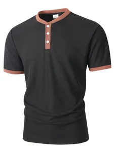 Detailed view of the contrast color collar and button placket on the waffle knit shirt.